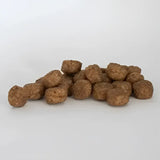 Brown round kibble pellets for skinners field complete working dog food working trial use