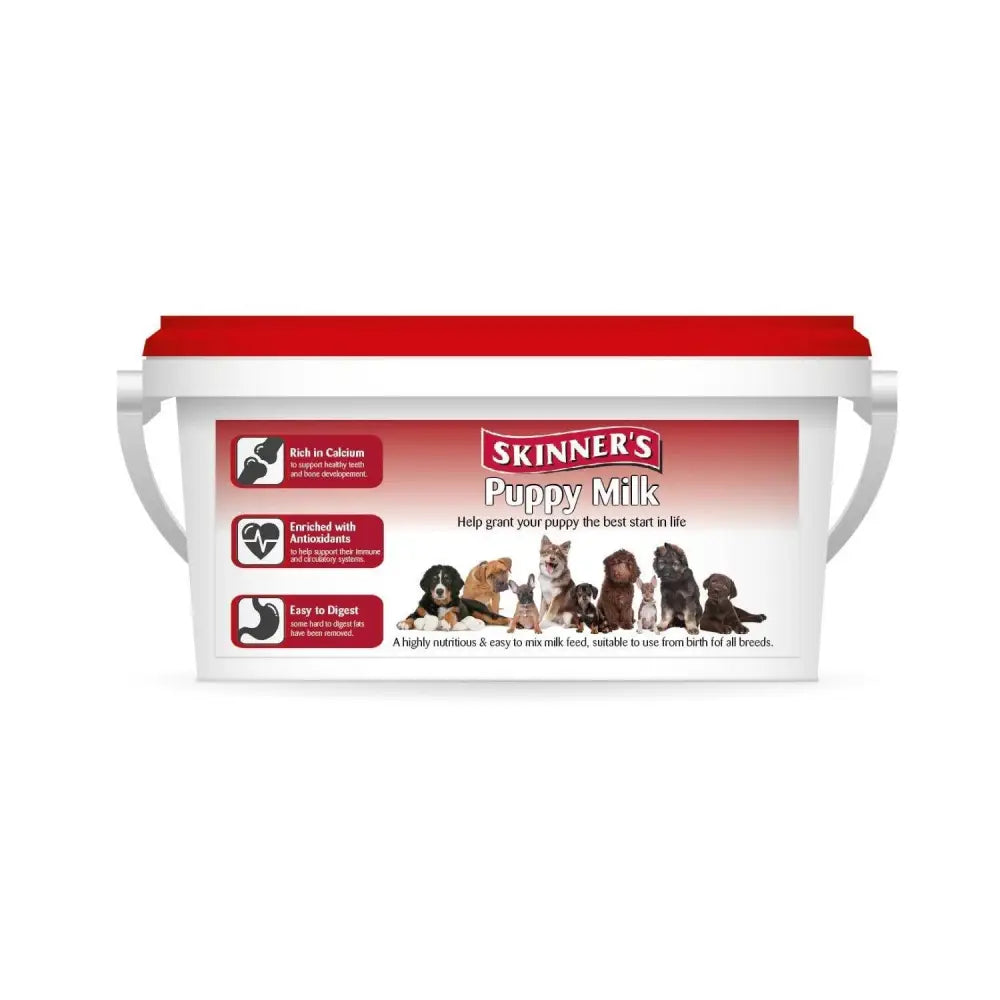White plastic bucket with red lid and handles labeled skinners puppy milk complete milk substitute with puppy images