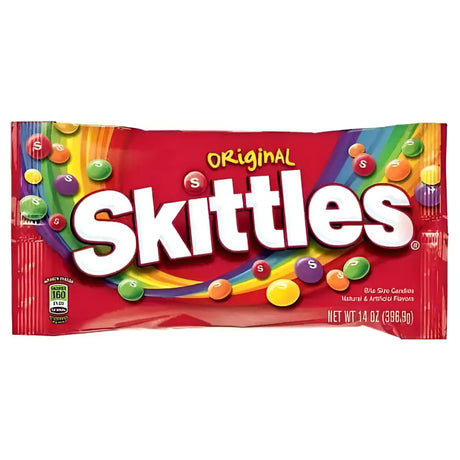 A vibrant red packet of skittles original candy with rainbow graphics perfect for tuck shop sweet treats