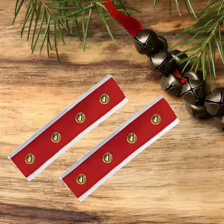 Red rectangular holiday ornament strips with gold button accents as limited edition sleigh bell bridle accessories by equetech