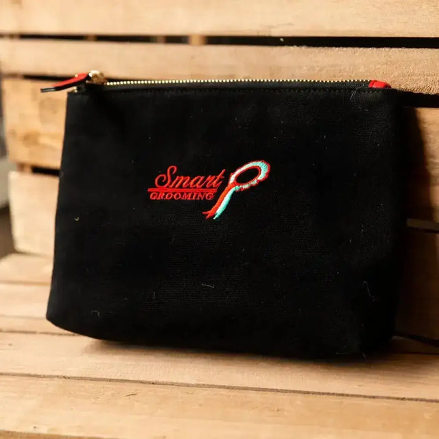 Black hard wearing fabric grooming accessories pouch with red teal smart grooming logo and zipper one size