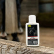White plastic bottle of smart grooming lavender splosh wash soothing cooling hoof wash for horses