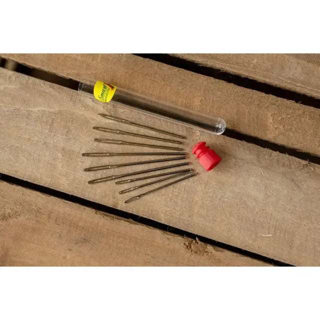 Set of ten brass-colored metal smart grooming plaiting needles with yellow-labeled tube and red cap for braiding horses