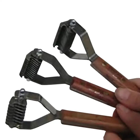 Three wooden handled metal pet grooming tools with spring loaded comb heads from smart tails professional