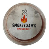 A round clear plastic container with a white label showing smokey sam’s logo for sam’s smoked paprika