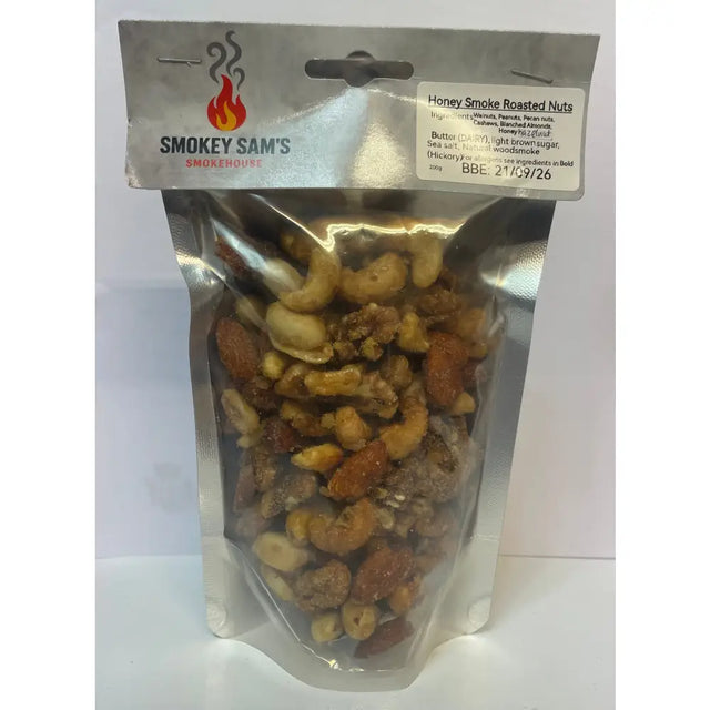 A shiny silver pouch of smokey sams honey roast hickory smoked nuts with cashews almonds and peanuts coated in brown sugar