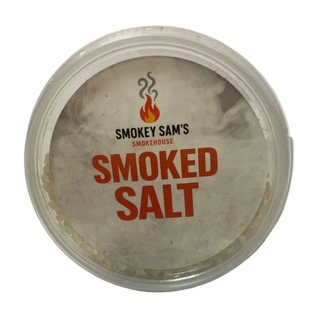 Clear plastic container of smokey sams smoked salt with white label bold orange text and flame logo premium sea salt