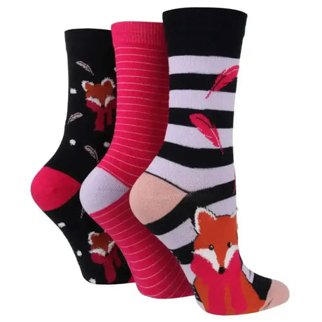 Three pairs of sockshop wild feet cotton crew socks in black pink and striped with fancy fox and feather designs
