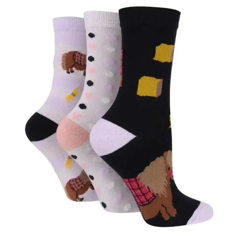 Three sockshop wild feet cotton crew socks with fun animal-themed dog designs in pastel and black cotton blend
