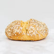Golden brown round white bread soda bread topped with toasted oats for a hearty homemade feel