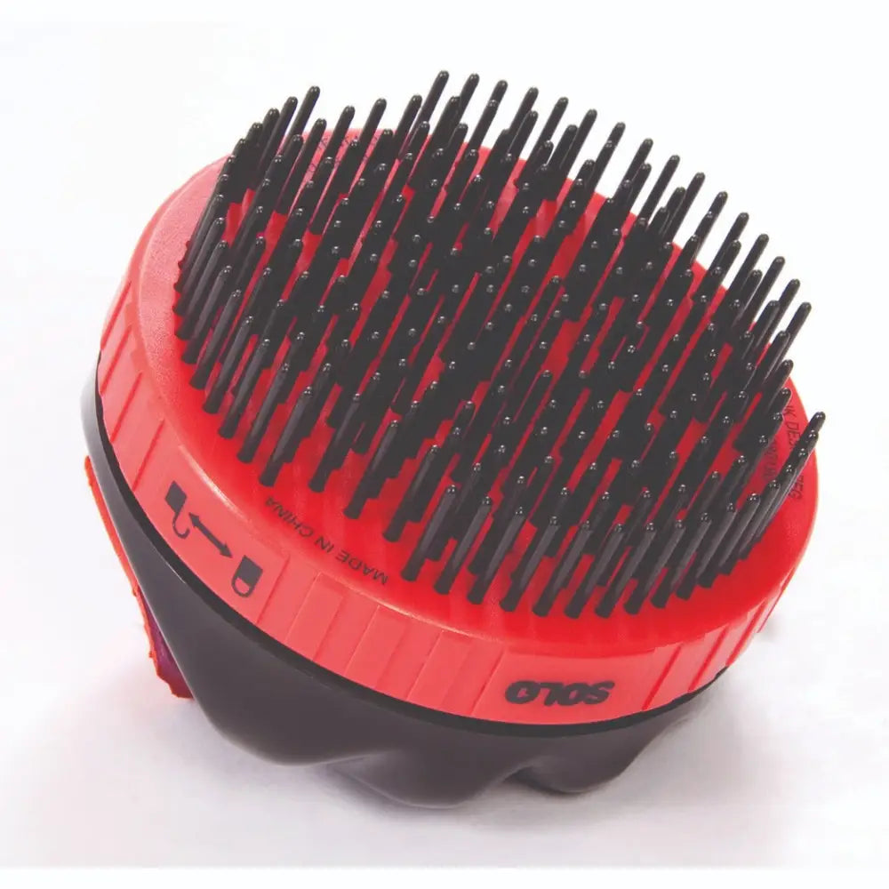 Red and black SoloComb retractable brush with dense stiff bristles for hygienic twist brush hair care and easy brushing