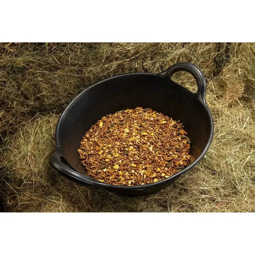 Black ceramic bowl with handles filled with spillers lay off mix herbs for early training in equestrian use