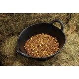 Black ceramic bowl with handles filled with spillers lay off mix herbs for early training in equestrian use