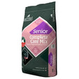 Dark green bag of spillers senior care mix dog food with pink purple label showing black dog face for complete nutritional care including digestive health