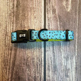 A light blue days collar with colorful sprinkles pattern and black plastic hardware perfect for playful pups