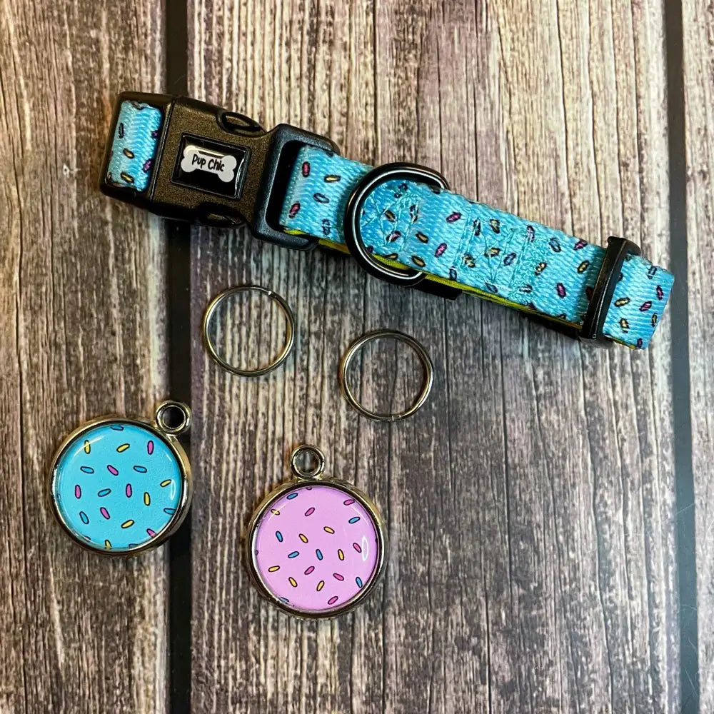 Turquoise days collar with donut pattern black hardware and matching sprinkle-themed circular tags for dogs