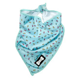 Light blue cooling bandana blue with colorful sprinkles pattern and black bone-shaped brand tag for days cooling bandana use