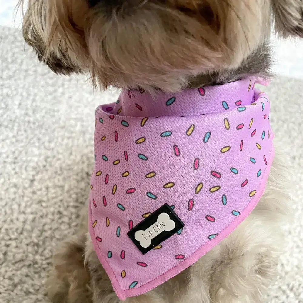 Pink sprinkles for days cooling bandana made with cooling fabric featuring a black pup chic bone tag