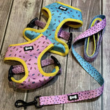 Pastel pink and blue sprinkle print reversible dog harness with yellow trim and matching leash from sprinkles for days collection