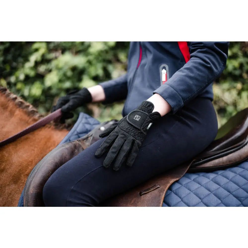 Black ssg digital riding glove style 2100 with textured fabric and small logo on wristband backside view