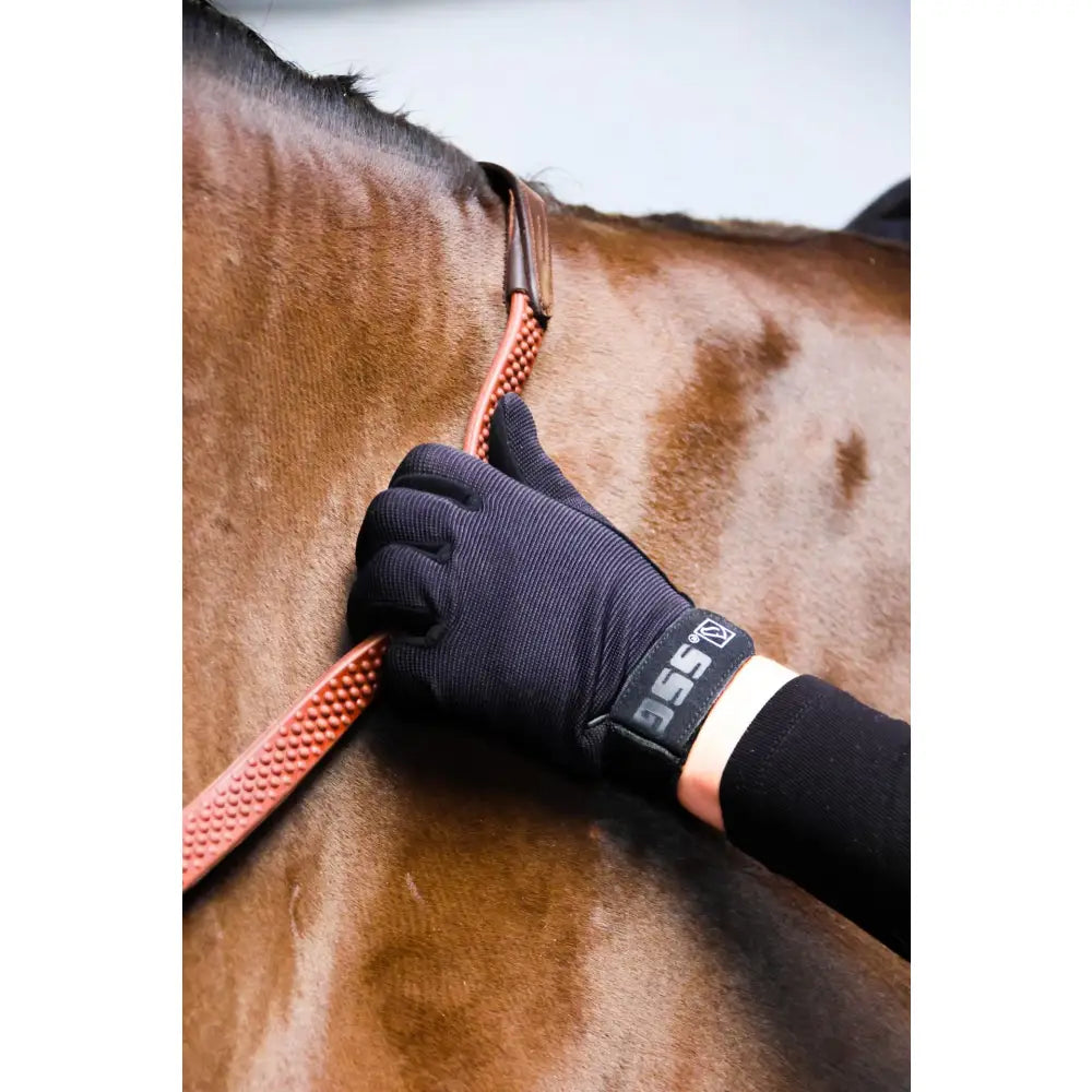 Black textured ssg riding gloves with branded wrist strap for weather childs riding and childs riding gloves use