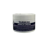 White plastic jar of stableline arnica cream with a dark blue label showing stableline arnica traditional herbal cream