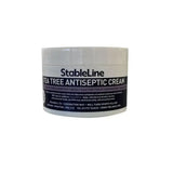 Stableline tea tree antiseptic cream in a white jar with black and gray label for soothing skin care