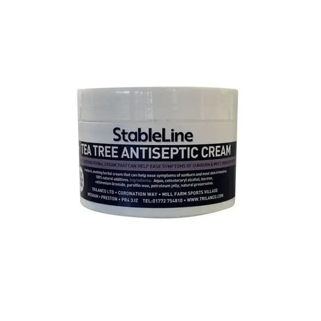 Stableline tea tree antiseptic cream in a white jar with black and gray label for soothing skin care