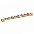 A delicate stock pin diamante gold plated bar with sparkling pink diamante crystals for stylish accessorizing