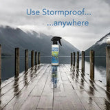 A white stormproof water repellent spray 500ml bottle with black nozzle and blue label, no nauseating chemical smell