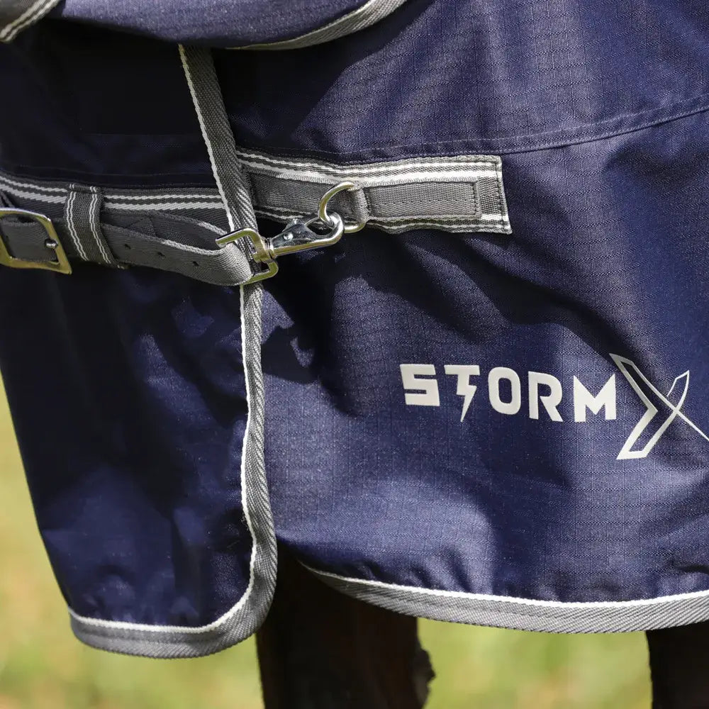 Navy blue StormX Empra combi turnout rug with STORM branding and silver trim