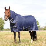 Horse in a navy blue StormX Empra Combi Turnout Rug resting in a field