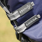 Dark blue stormx empra combi turnout rug straps with gray fabric and white stitching for durable outdoor use
