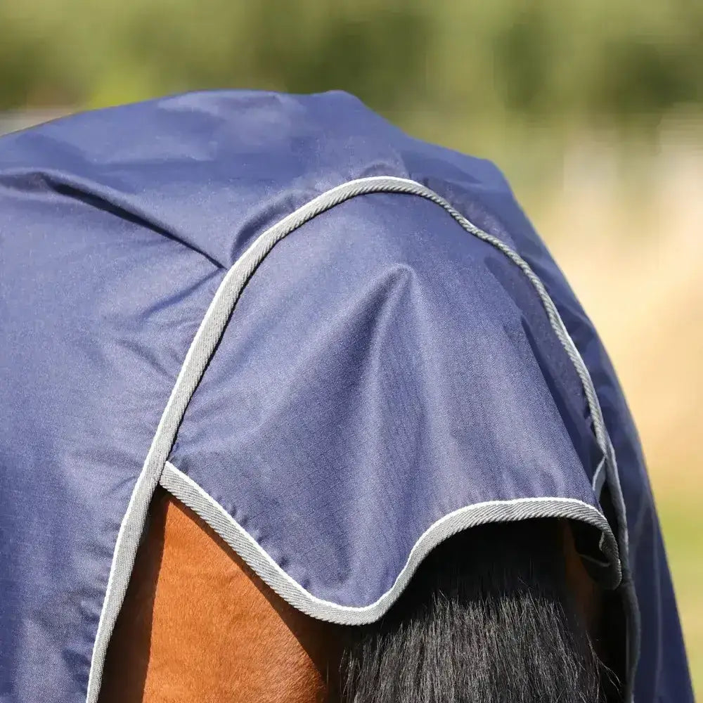Navy blue stormx empra 100 combi turnout rug with light gray stitched trim perfect for all weather use