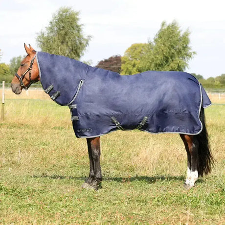 Navy blue stormx empra 100 combi turnout rug with gray trim and black buckles for stormx empra turnout rug use