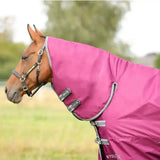 Vibrant pink stormx empra combi turnout rug with gray trim and black buckles for horses staying dry and comfy
