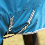 Blue stormx empra 50 turnout rug with silver zippers and black brand tag perfect for equestrian use