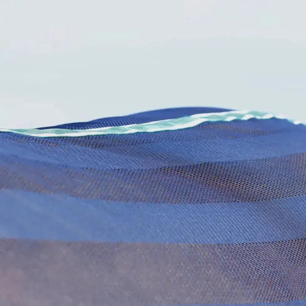 Blue mesh fabric with subtle green and white striped border on stormx empra air motion cooler rug