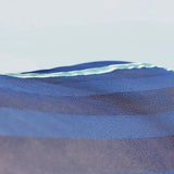 Blue mesh fabric with subtle green and white striped border on stormx empra air motion cooler rug