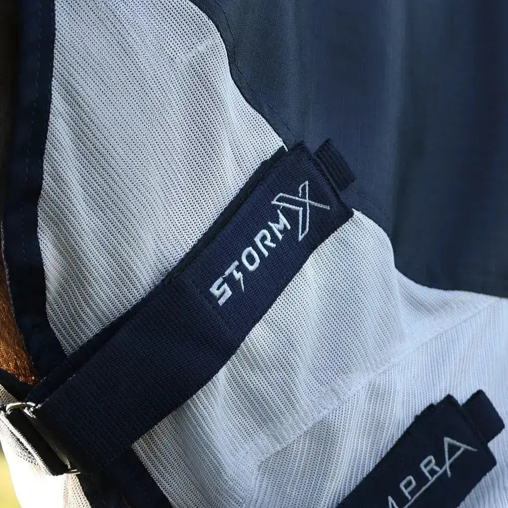Black embroidered stormx label on white mesh fabric of stormx empra aqua shield fly rug