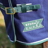 Deep blue stormx empra opulence fleece rug with green white trim gold buckle and storm empr logo patch