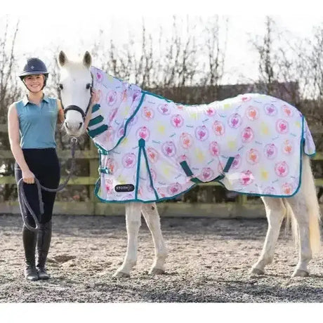 White horse blanket from stormx original thelwell collection with pink and yellow hearts teal trim rounder combi fly rug