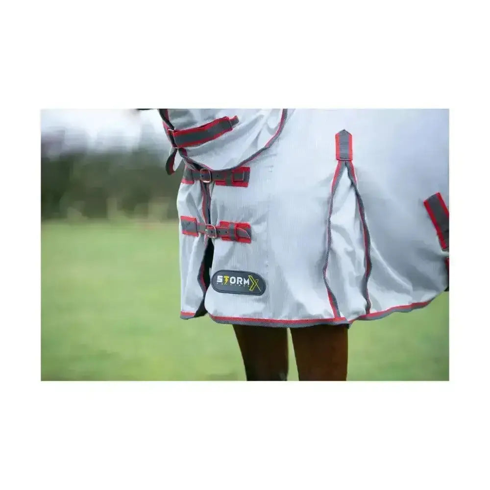 Gray stormx original protect neck fly rug with red black trim adjustable straps and reflective logo patch