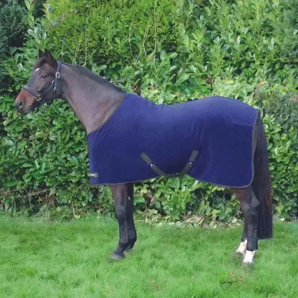 Navy blue stormx original snug fleece rug with black straps designed for warmth and comfort on horses
