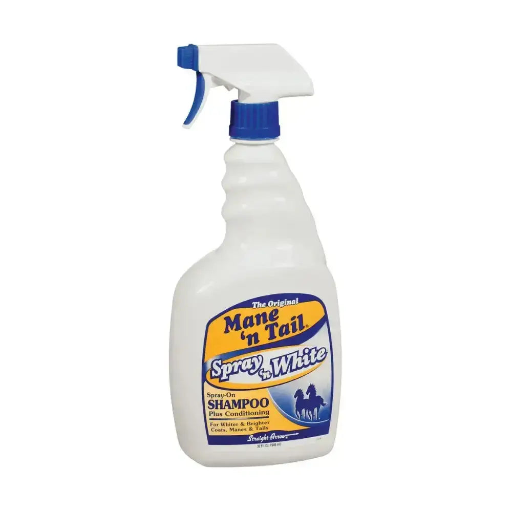 White plastic spray bottle with blue trigger labeled straight arrow mane mane n tail spray n white for horse care