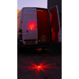 Red led light array on ground projecting onto white van rear door from streetflare horse box hazard warning kit
