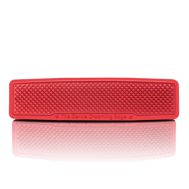 Red silicone grooming edge with diamond texture on striphair gentle groomer for easy-to-use coat conditioning and hair removal tool