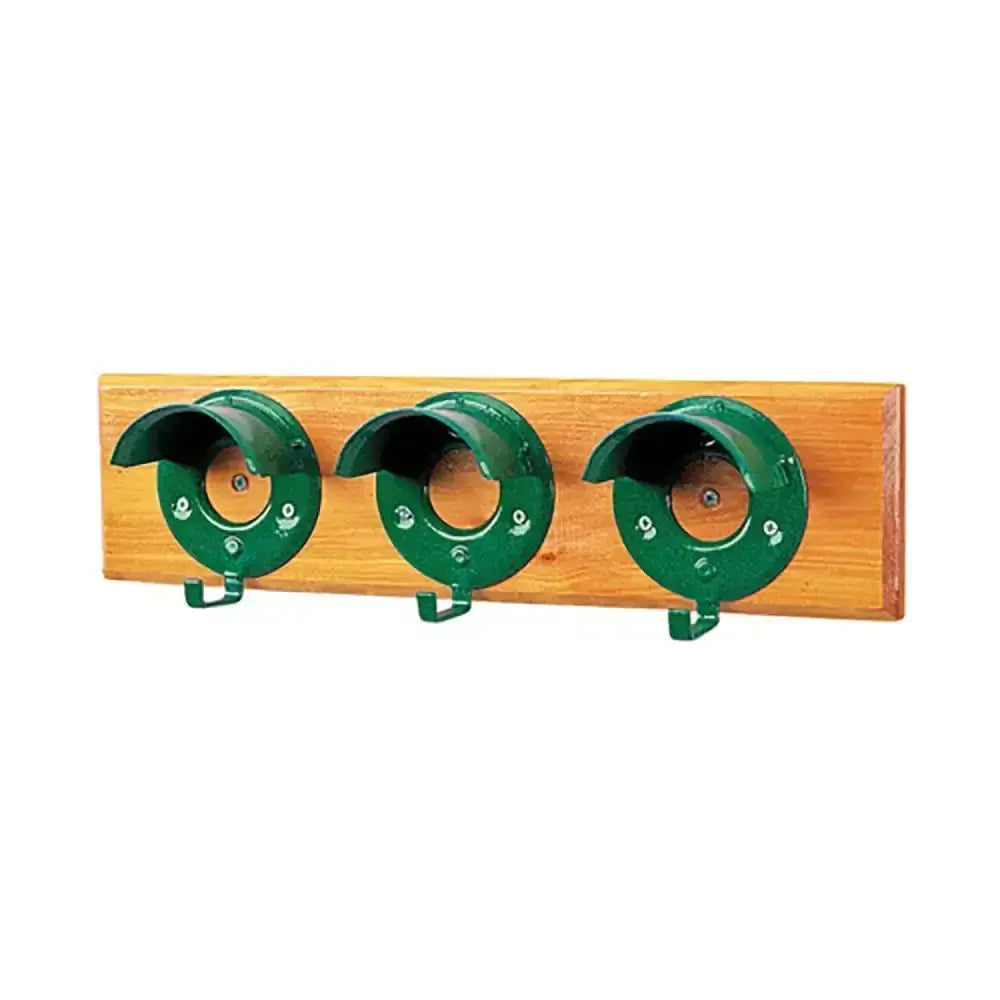 Green metal garden hose holder mounted on light wood plank featuring stubbs bridle rack specially designed round cowl board s203