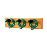 Green metal garden hose holder mounted on light wood plank featuring stubbs bridle rack specially designed round cowl board s203