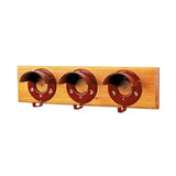 Red metal hat hooks on light wood plank of stubbs bridle rack set board s203 with specially designed round cowl